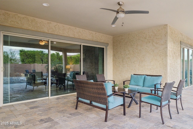 view of patio with an outdoor hangout area and a ceiling fan