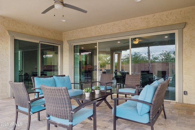 view of patio featuring ceiling fan