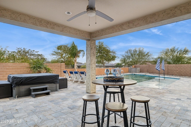 view of patio / terrace featuring a fenced in pool, a fenced backyard, and a ceiling fan