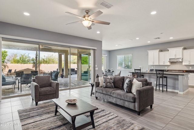 living area featuring recessed lighting, visible vents, ceiling fan, and light tile patterned floors