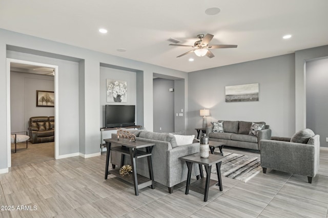 living room with recessed lighting, baseboards, and ceiling fan