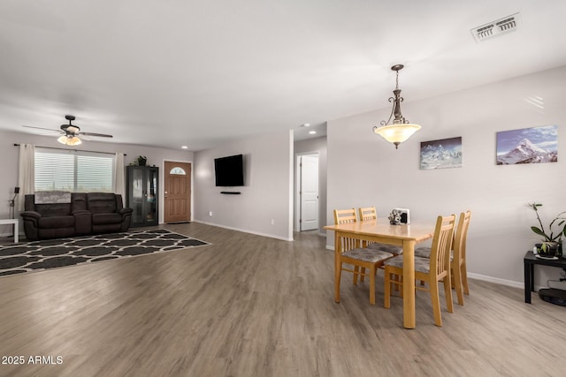 dining space with visible vents, baseboards, light wood-style flooring, ceiling fan, and recessed lighting