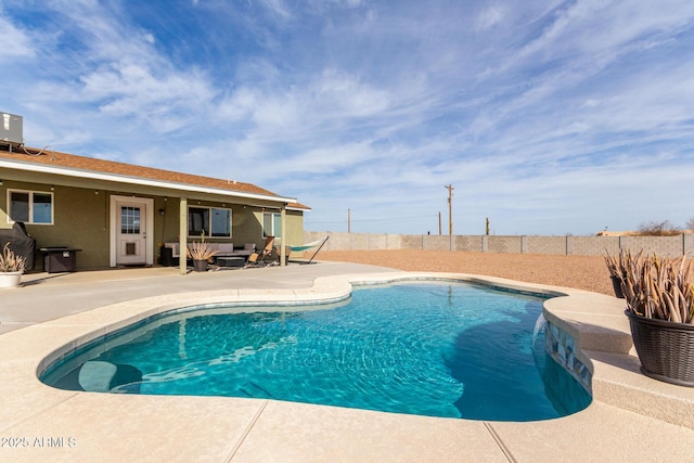 view of pool with an outdoor living space, a patio area, a fenced backyard, and a fenced in pool