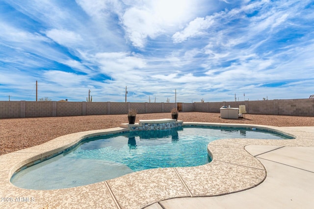 view of swimming pool featuring a patio area, a fenced backyard, and a fenced in pool