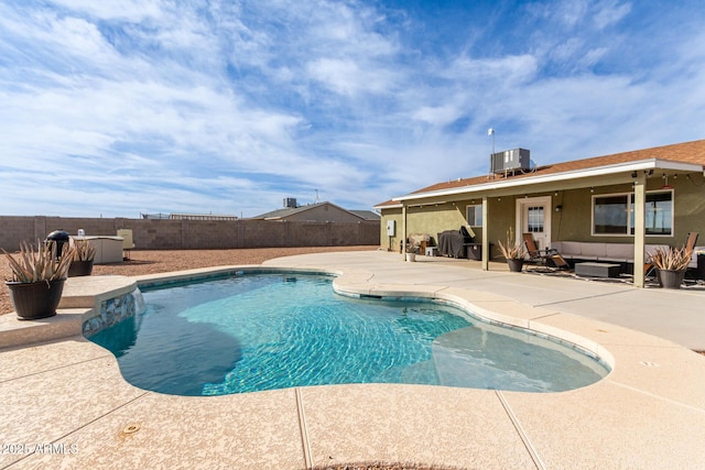 view of swimming pool with a fenced in pool, a fenced backyard, a patio area, an outdoor living space, and central AC