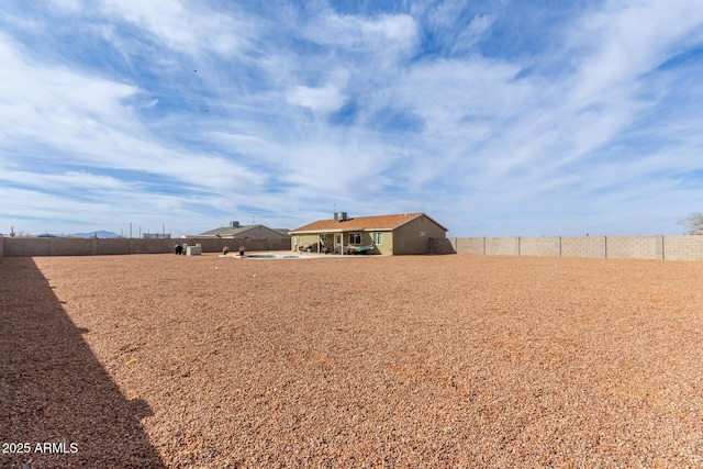 view of yard with a patio and a fenced backyard