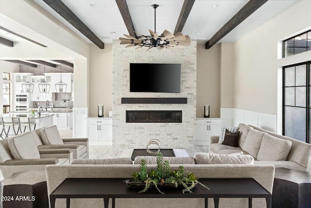 living room with beam ceiling