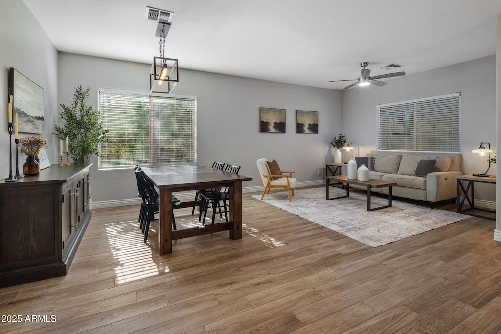 dining area featuring ceiling fan and light hardwood / wood-style flooring