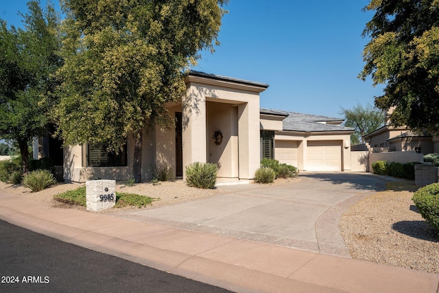 view of front of property with a garage