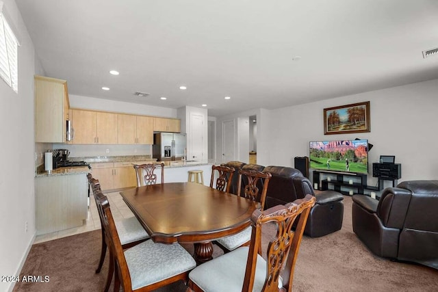 carpeted dining room with baseboards, visible vents, and recessed lighting