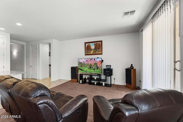 living room with light carpet and visible vents