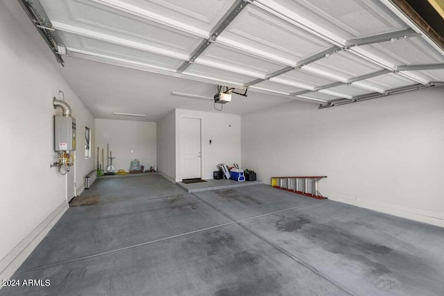 garage with a garage door opener and water heater