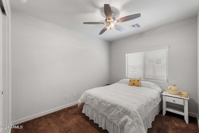 bedroom featuring carpet, baseboards, visible vents, and a ceiling fan