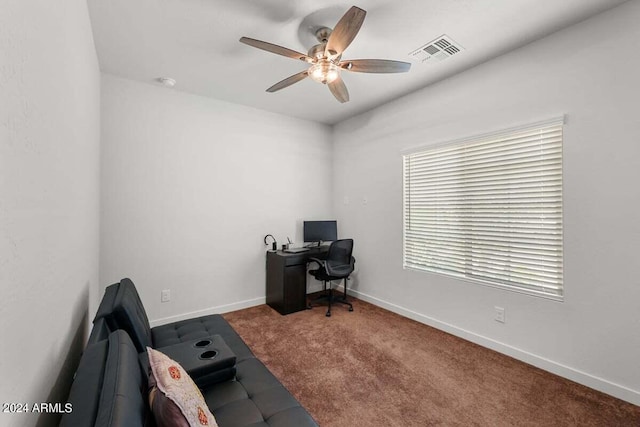 office space with a ceiling fan, baseboards, visible vents, and carpet flooring