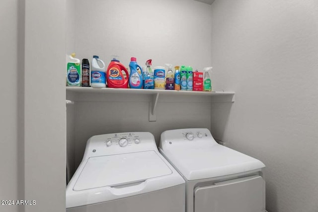 clothes washing area featuring laundry area and separate washer and dryer