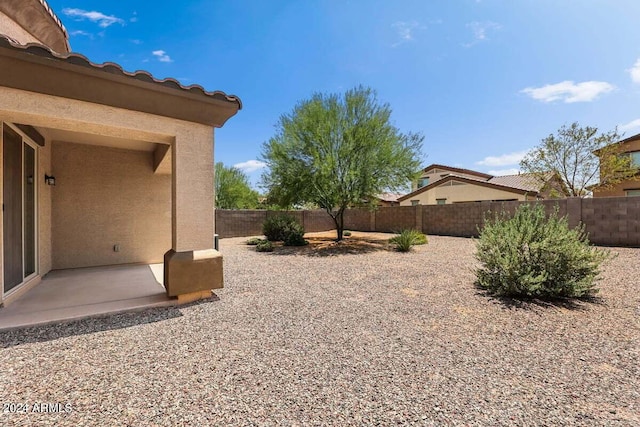 view of yard with a patio and a fenced backyard