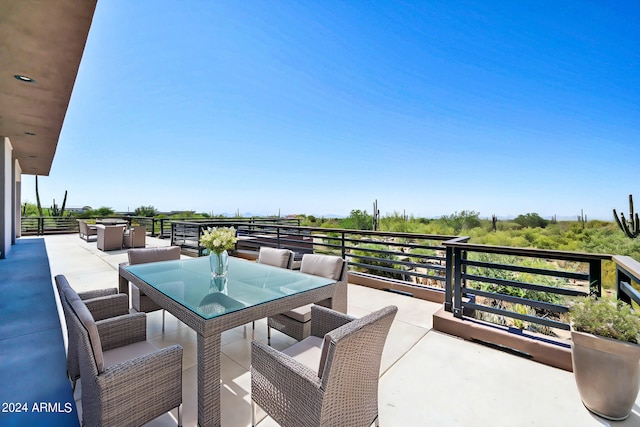 view of patio featuring a balcony