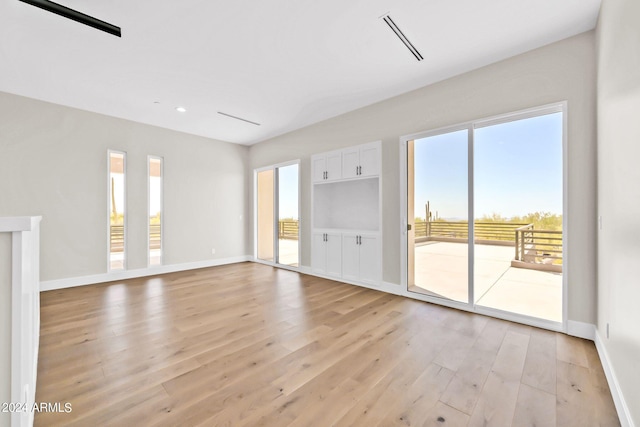 unfurnished living room with light hardwood / wood-style flooring