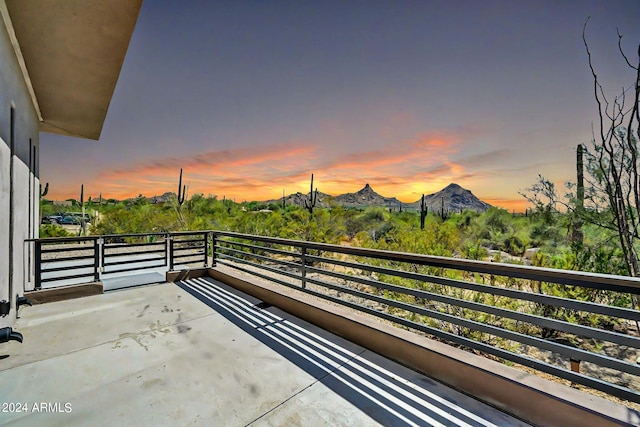 balcony at dusk with a mountain view