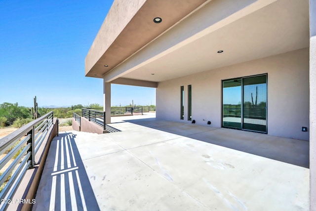 view of patio featuring a balcony