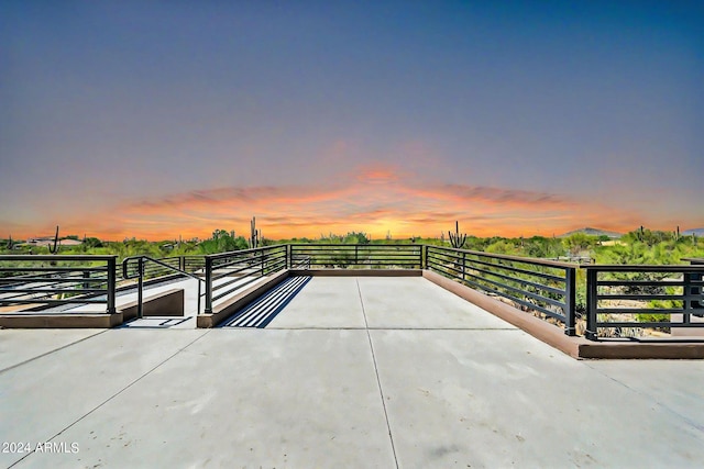 view of patio terrace at dusk