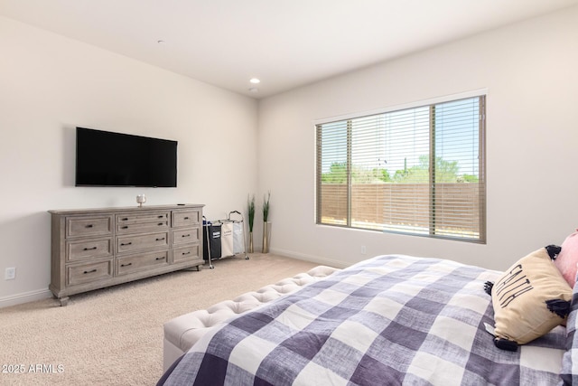 bedroom with light carpet, recessed lighting, and baseboards