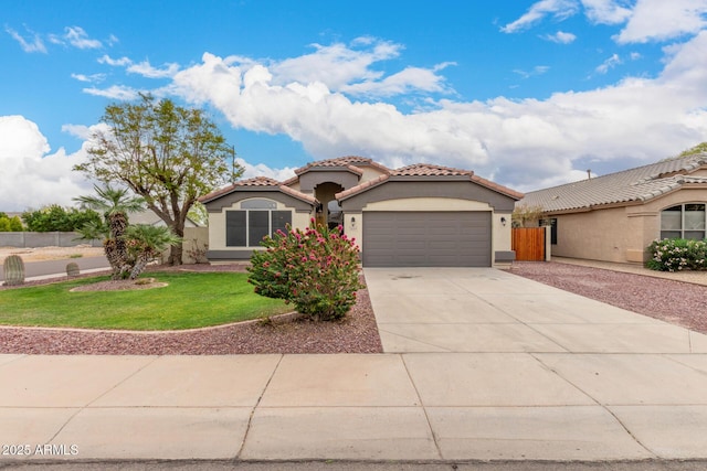 10209 W Jessie Ln, Peoria, AZ 85383 - mediterranean / spanish house featuring stucco siding, driveway, an attached garage, and a tile roof