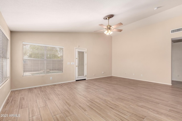 10209 W Jessie Ln, Peoria, AZ 85383 - spare room featuring light wood-style flooring, a ceiling fan, vaulted ceiling, and baseboards