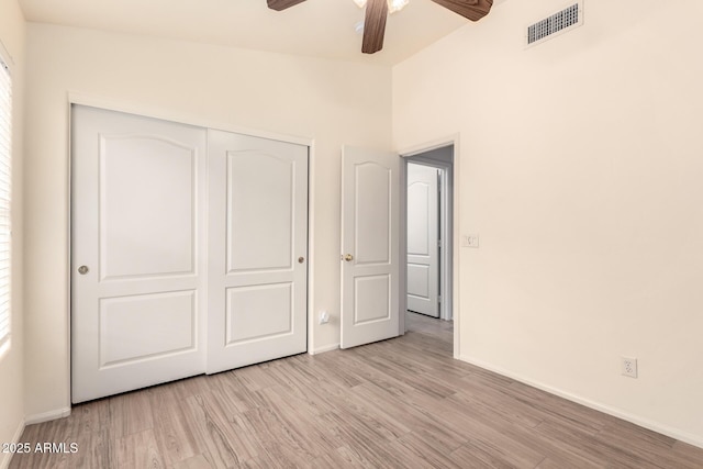 10209 W Jessie Ln, Peoria, AZ 85383 - unfurnished bedroom featuring wood finished floors, baseboards, a closet, and a ceiling fan