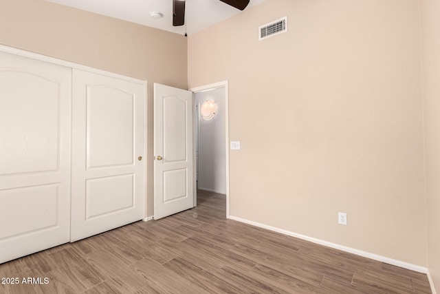 10209 W Jessie Ln, Peoria, AZ 85383 - unfurnished bedroom with a closet, wood finished floors, baseboards, and ceiling fan