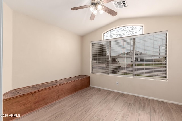 10209 W Jessie Ln, Peoria, AZ 85383 - spare room with vaulted ceiling, a ceiling fan, wood finished floors, and baseboards