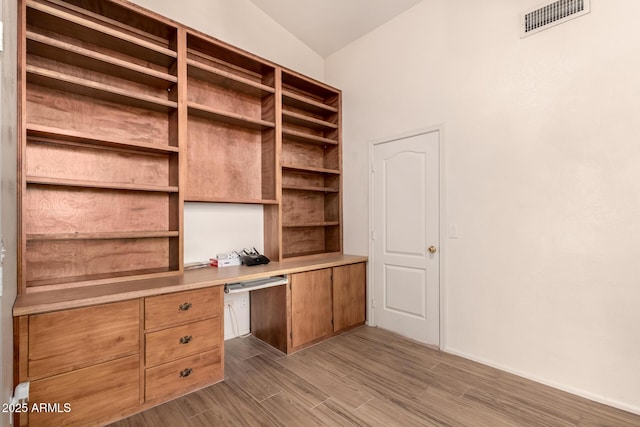 10209 W Jessie Ln, Peoria, AZ 85383 - unfurnished office with built in desk, wood finished floors, and vaulted ceiling