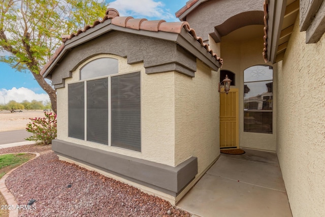 10209 W Jessie Ln, Peoria, AZ 85383 - view of property exterior with stucco siding and a tiled roof
