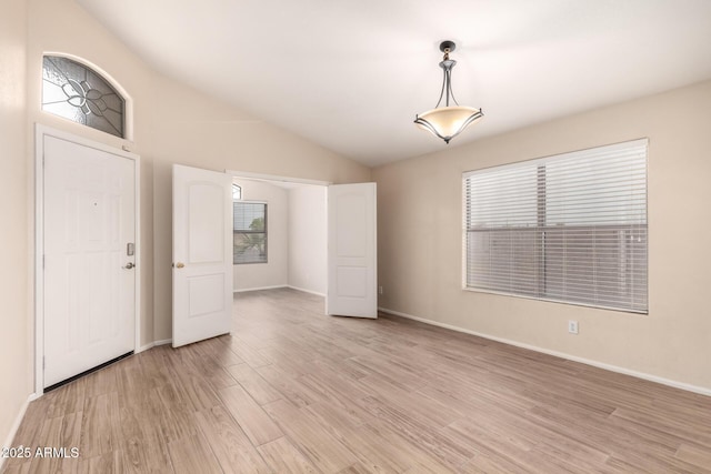10209 W Jessie Ln, Peoria, AZ 85383 - entryway with light wood finished floors, lofted ceiling, and baseboards