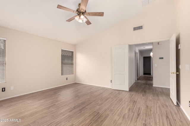 10209 W Jessie Ln, Peoria, AZ 85383 - empty room with a ceiling fan, light wood-style floors, baseboards, and high vaulted ceiling