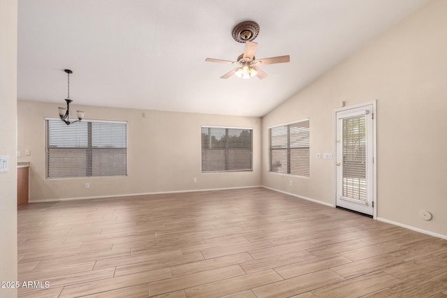 10209 W Jessie Ln, Peoria, AZ 85383 - empty room featuring a chandelier, lofted ceiling, a ceiling fan, light wood-style floors, and baseboards