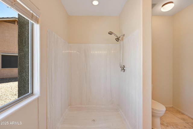 bathroom featuring tile patterned flooring, visible vents, toilet, and walk in shower