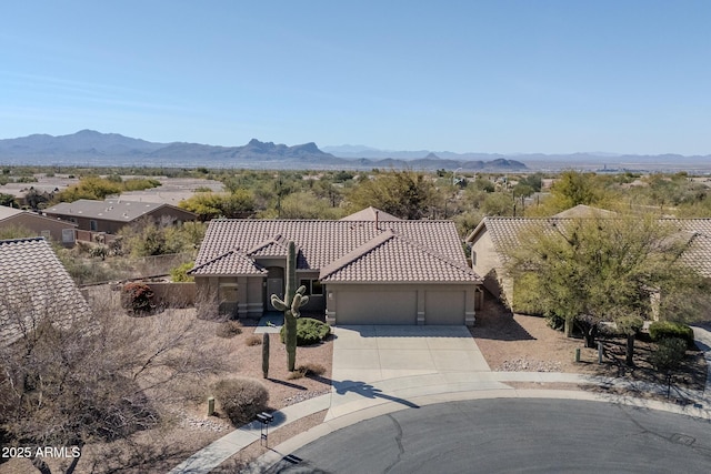 drone / aerial view featuring a mountain view
