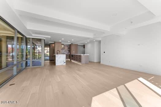 unfurnished living room featuring recessed lighting and light wood-style floors