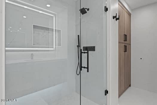 bathroom featuring a shower stall