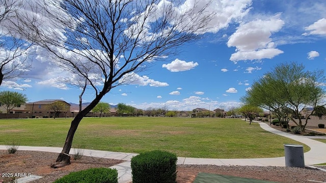 surrounding community with a yard