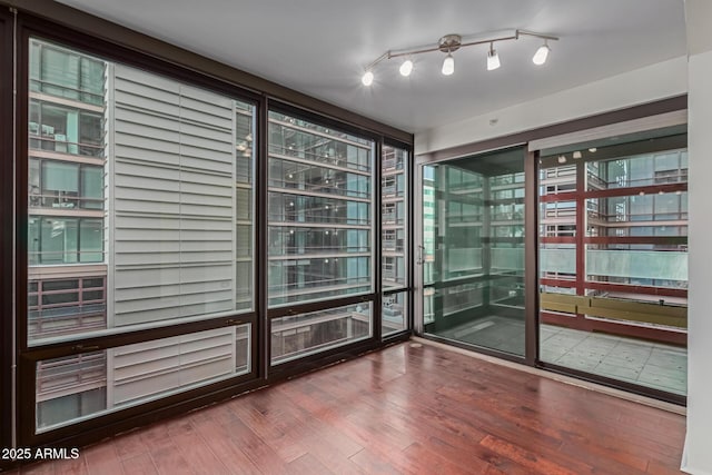 unfurnished room featuring wood-type flooring