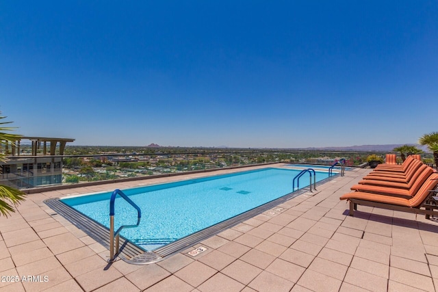 view of swimming pool with a patio