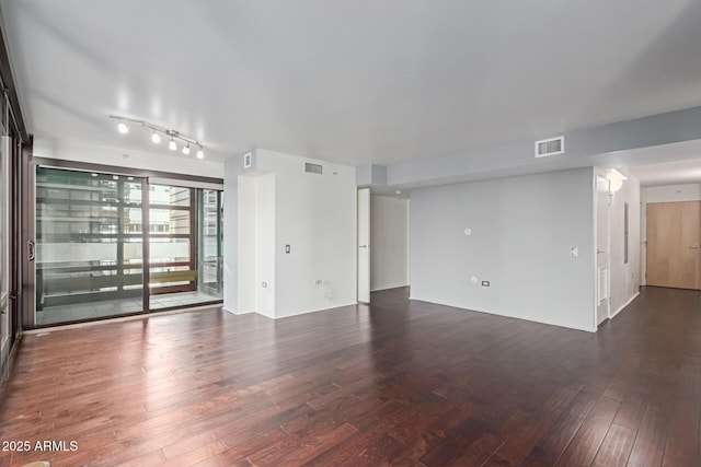 empty room featuring dark hardwood / wood-style floors