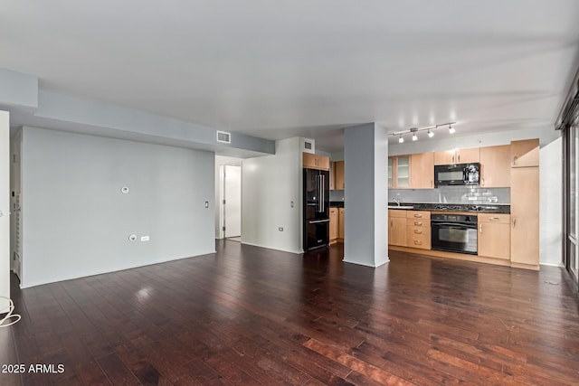 kitchen featuring tasteful backsplash, dark hardwood / wood-style floors, black appliances, sink, and light brown cabinetry