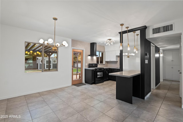 kitchen with white cabinetry, black gas stove, exhaust hood, and decorative light fixtures