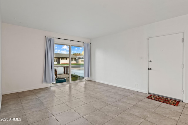 empty room with light tile patterned floors