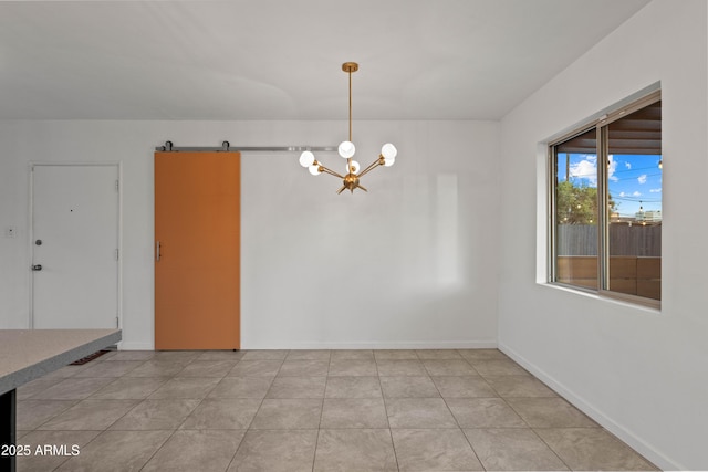 unfurnished dining area featuring a barn door, a chandelier, and light tile patterned floors