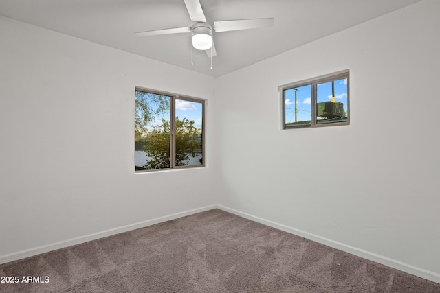 spare room featuring carpet and ceiling fan