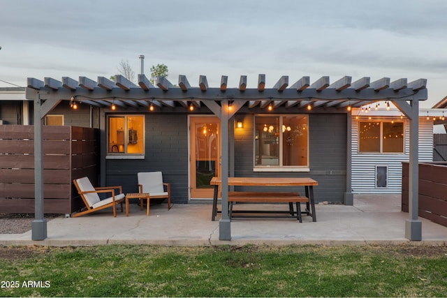 rear view of property with a patio area and a pergola